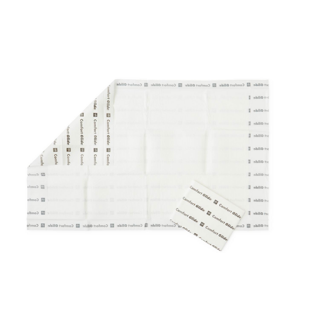 The Medline ComfortGlide Drypad Underpads - XL are large, white, rectangular sterile dressings with repeated ComfortGlide DryPads branding; a smaller folded pad is placed on top of the larger underpad.